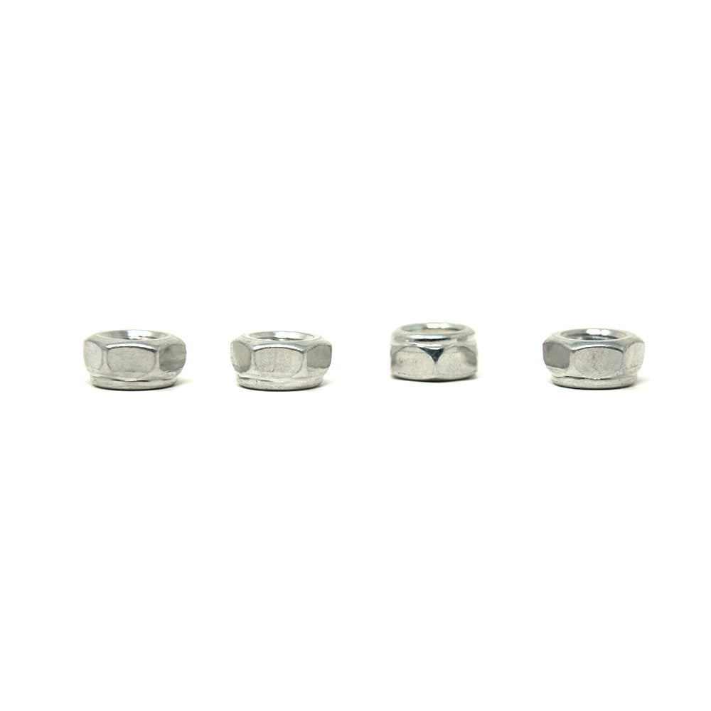 Four lock nuts laying flat.