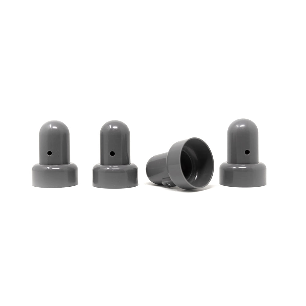 Four grey pole caps with one knocked over.