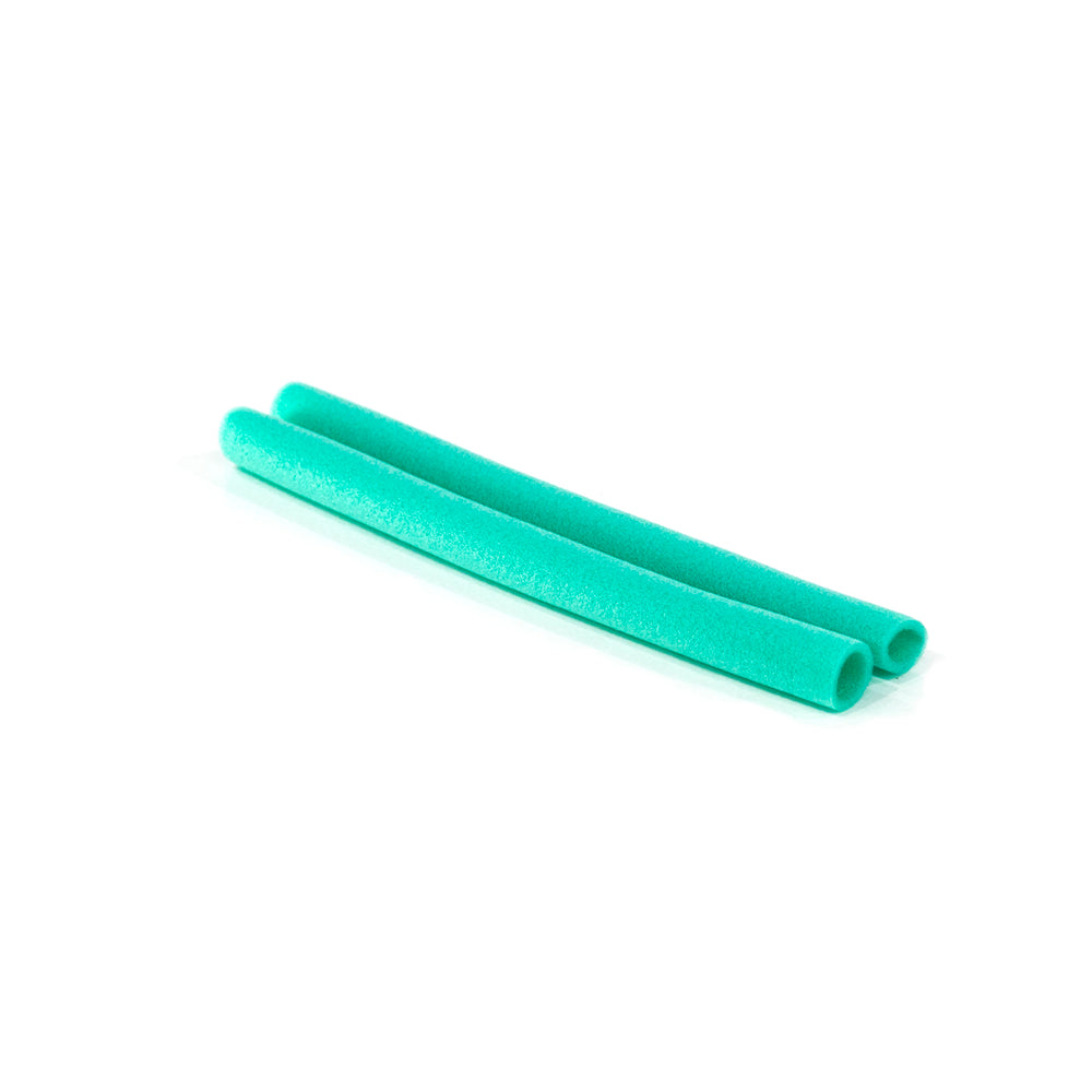 Two pieces of seafoam green handrail foam.