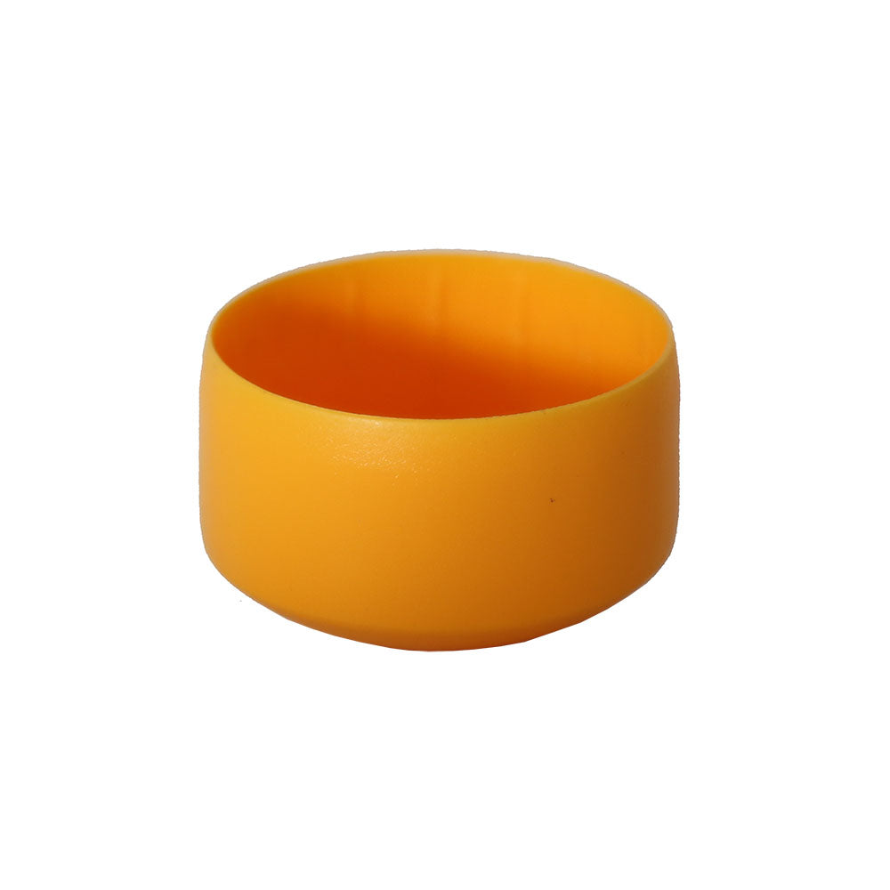 Yellow cap covers the tops of poles on the jungle gym base.