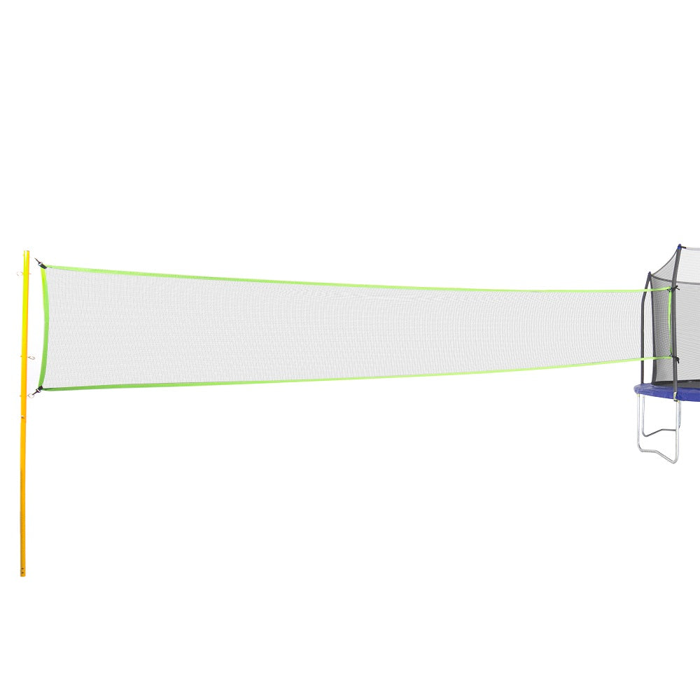 The yellow, green, and gray volleyball net is attached to a trampoline on one side.