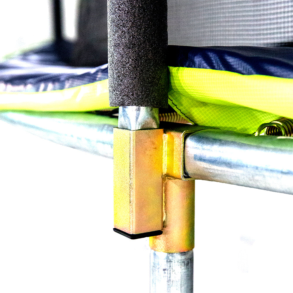 The lime green and navy spring pad sits above the t-socket and trampoline frame.