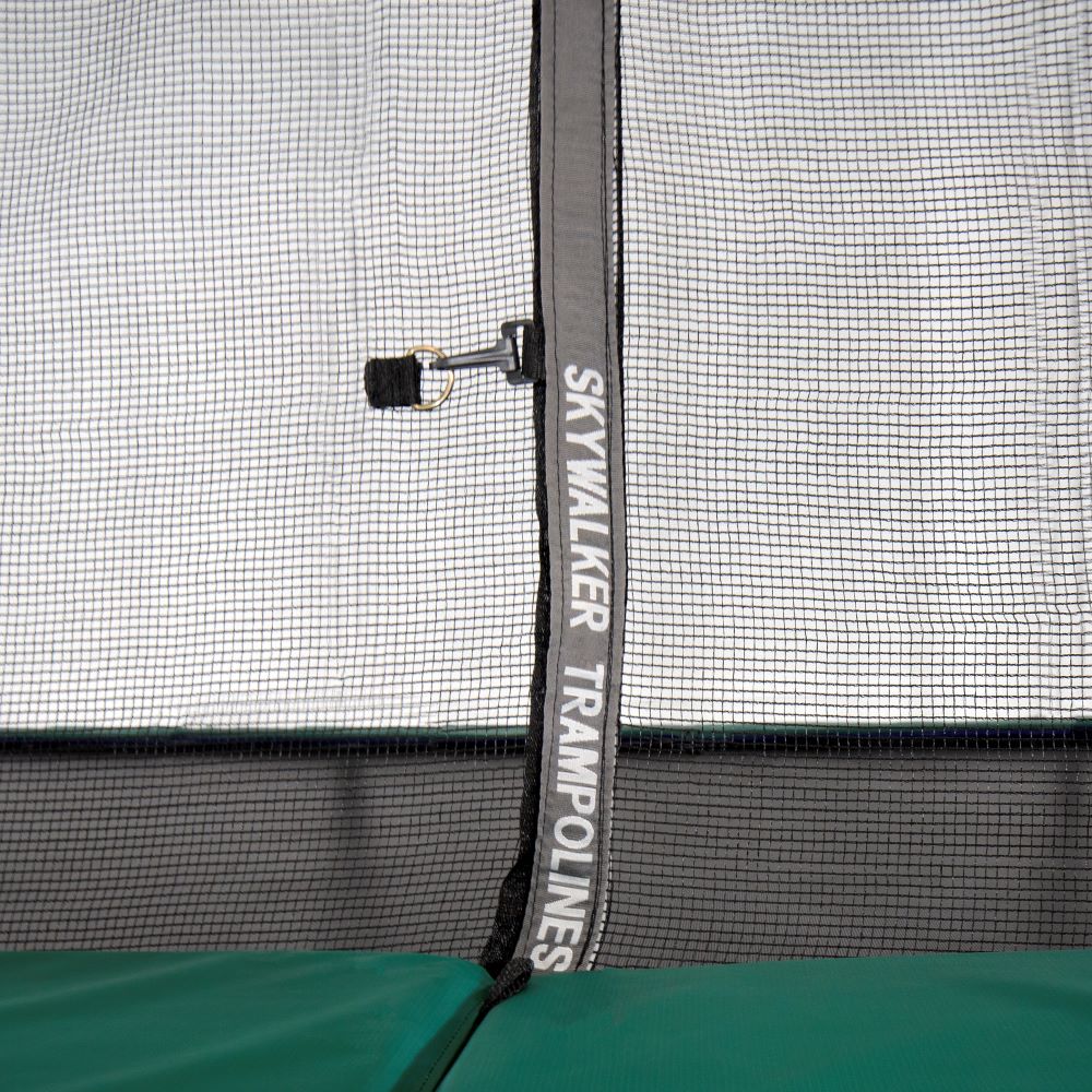 The zipper on the enclosure net reads, "Skywalker Trampolines" in white font.