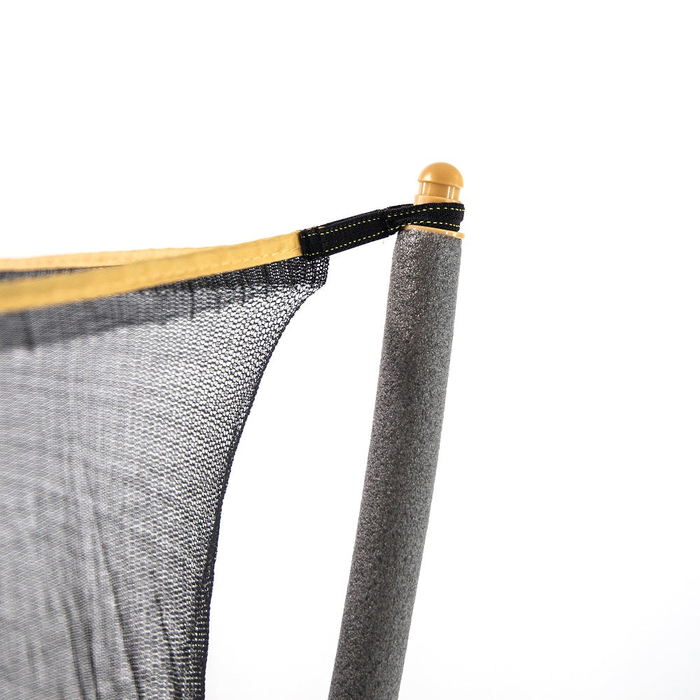 The mini trampoline's enclosure net is pulled around a tiny yellow pole cap on top of gray foam padded enclosure pole. 