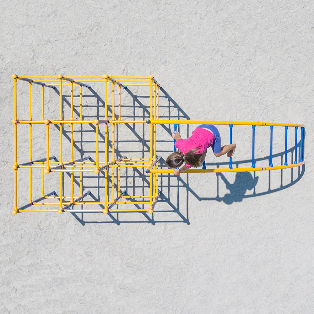 Birds-eye view of girl climbing up the Arched Ladder. 